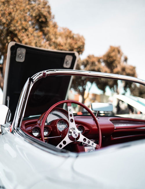 a white car on display in a car show